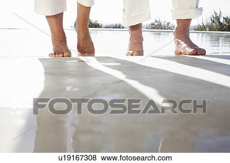 Walking close to a pool View Large Photo Image Stock Photo - Walking close to a pool. Fotosearch