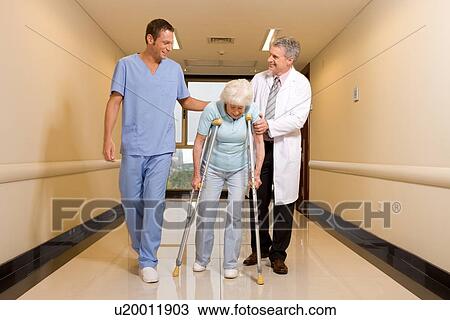 Walking with crutches View Large Photo Image Stock Image - Walking with crutches. Fotosearch