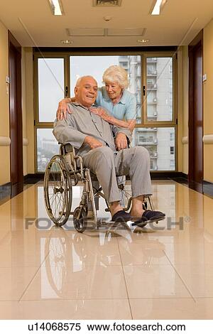Wife looking after her husband View Large Photo Image Stock Photography - Wife looking after her husband. Fotosearch