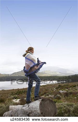 Woman enjoying the landscape View Large Photo Image Stock Photograph - Woman enjoying the landscape. Fotosearch