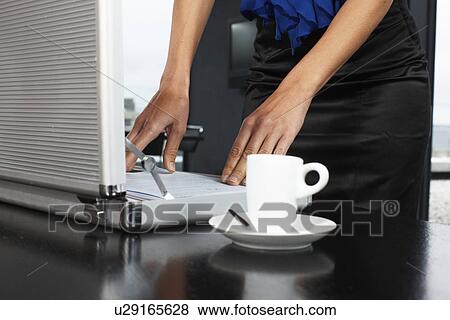 Stock Photo - Woman hands with a suit case. Fotosearch