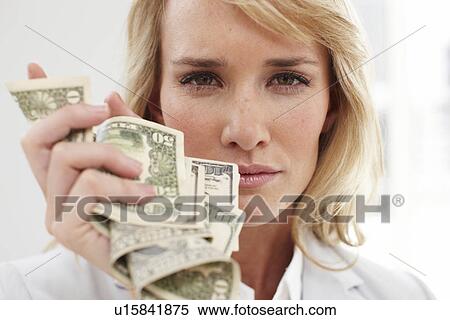 Woman holding money View Large Photo Image Stock Photography - Woman holding money. Fotosearch