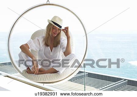 Woman in a luxurious house View Large Photo Image Stock Image - Woman in a luxurious house. Fotosearch