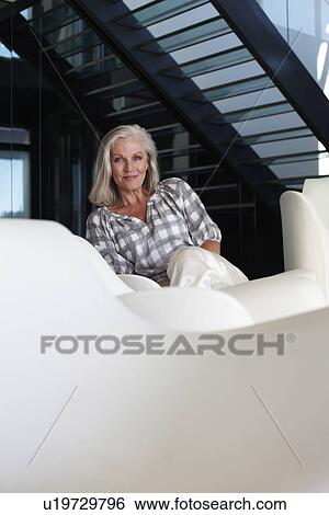 Stock Photograph - Woman in house. Fotosearch
