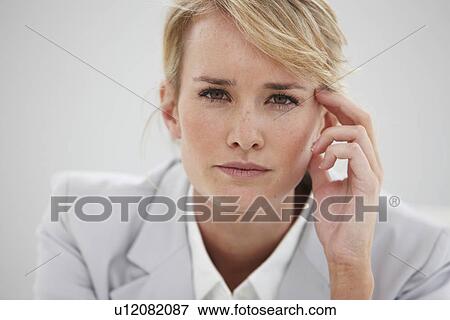 Stock Photo - Woman looking at camera. Fotosearch