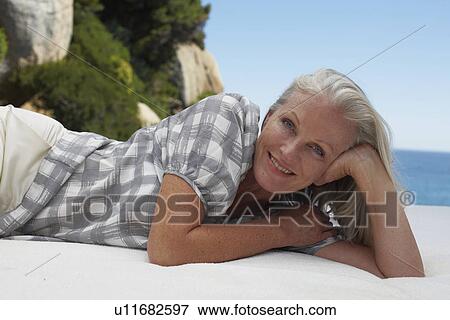 Woman relaxing View Large Photo Image Stock Photo - Woman relaxing. Fotosearch