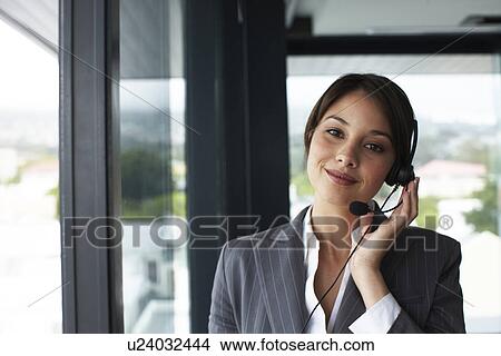 Picture - Woman with a headset. Fotosearch