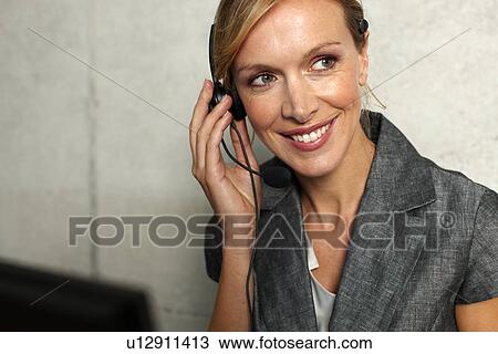 Woman with a headset View Large Photo Image Stock Image - Woman with a headset. Fotosearch