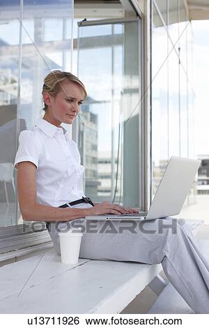 Woman with a laptop View Large Photo Image Stock Photograph - Woman with a laptop. Fotosearch