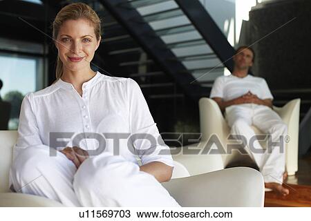 Woman with a man in the background View Large Photo Image Stock Image - Woman with a man in the background. Fotosearch