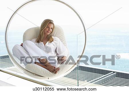 Stock Photography - Woman with sea in the background. Fotosearch