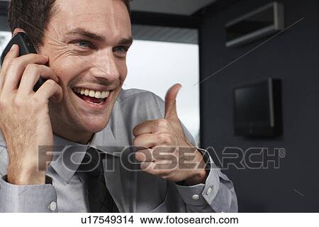 Young businessman doing OK sign View Large Photo Image Picture - Young businessman doing OK sign. Fotosearch