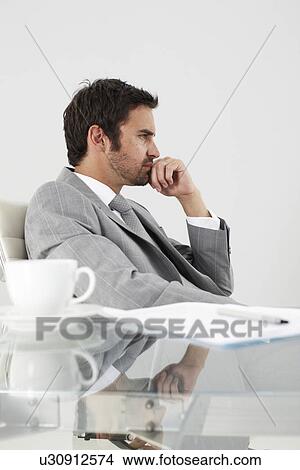Picture - Young businessman profile. Fotosearch