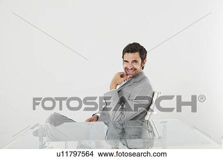 Picture - Young businessman smiling. Fotosearch