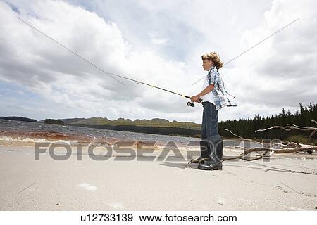 Young child fishing View Large Photo Image Stock Photo - Young child fishing. Fotosearch
