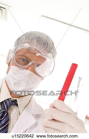 Stock Image - Young, confident scientist. Fotosearch