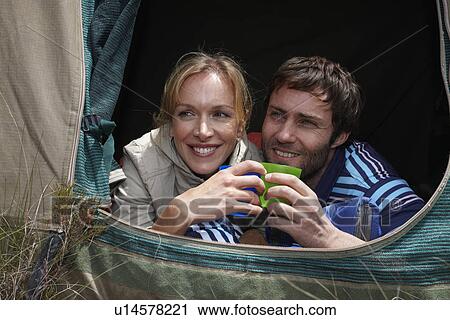 Stock Image - Young couple camping. Fotosearch