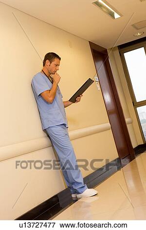 Stock Photo - Young doctor at work. Fotosearch