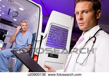 Stock Photograph - Young doctor at work. Fotosearch