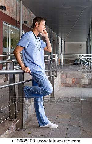 Stock Photo - Young doctor on a break. Fotosearch