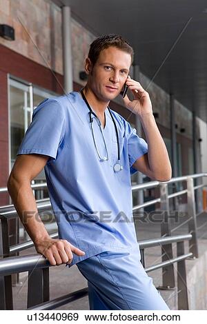 Stock Photo - Young doctor on a phone. Fotosearch