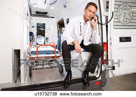 Young doctor on a phone View Large Photo Image Stock Photo - Young doctor on a phone. Fotosearch