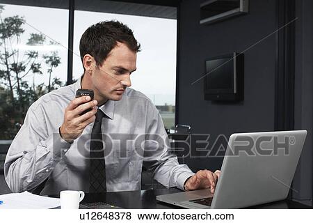Stock Photo - Young employee. Fotosearch