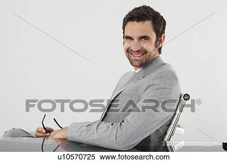 Young executive smiling View Large Photo Image Stock Photography - Young executive smiling. Fotosearch