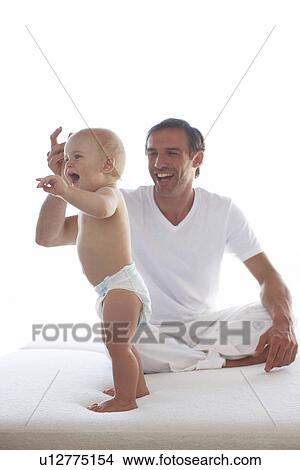 Picture - Young father with his baby. Fotosearch