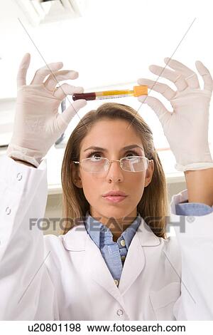 Stock Photo - Young laboratory technician. Fotosearch