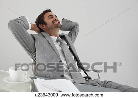 Young man having a break View Large Photo Image Stock Photo - Young man having a break. Fotosearch