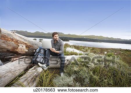 Young man in the countryside View Large Photo Image Stock Image - Young man in the countryside. Fotosearch