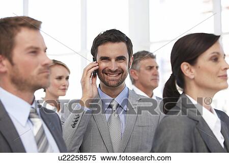 Young man making a call View Large Photo Image Stock Photography - Young man making a call. Fotosearch