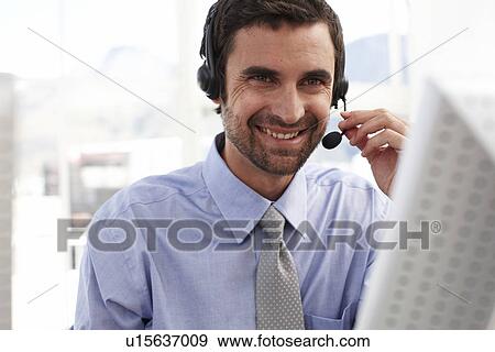 Stock Photo - Young man with a headphone. Fotosearch