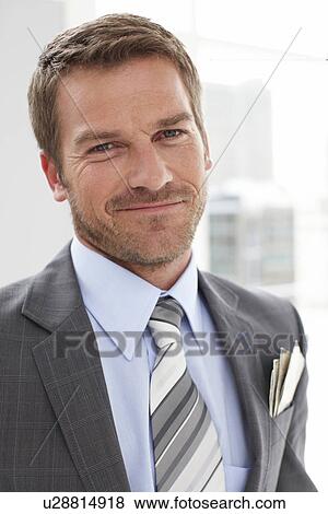 Stock Photo - Young man with dollar notes. Fotosearch