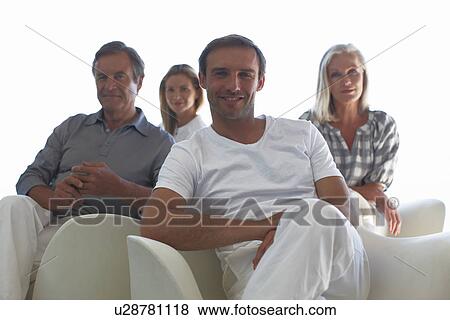 Stock Photo - Young man with his family. Fotosearch