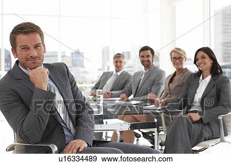 Stock Photo - Young man with his partners. Fotosearch