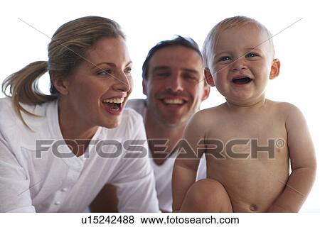 Young parents with their baby View Large Photo Image Stock Photo - Young parents with their baby. Fotosearch
