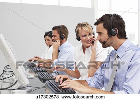 Stock Photo - Young people at work. Fotosearch