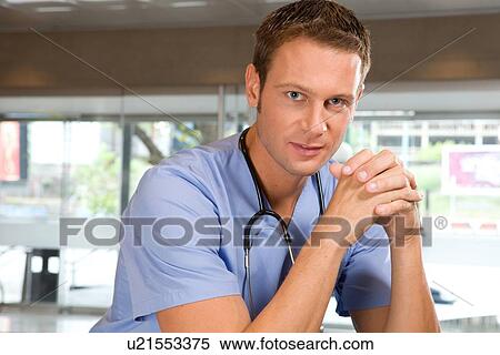 Young smiling doctor View Large Photo Image Stock Photography - Young smiling doctor. Fotosearch