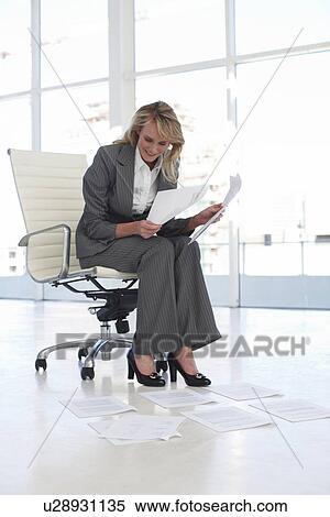 Young woman at work View Large Photo Image Stock Photography - Young woman at work. Fotosearch