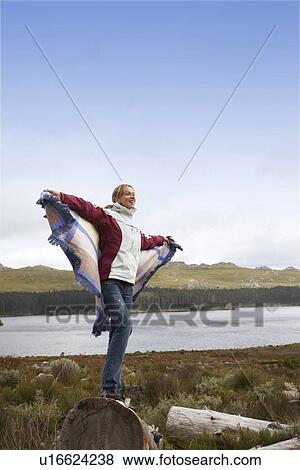 Stock Photo - Young woman in the countryside. Fotosearch