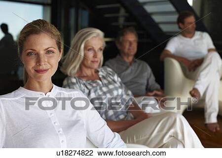 Young woman with her family View Large Photo Image Stock Image - Young woman with her family. Fotosearch
