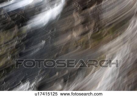 Abstract flowing rocks and boulders with white cloud wisps View Large Photo Image Stock Photography - Abstract flowing rocks and boulders with white cloud wisps. Fotosearch
