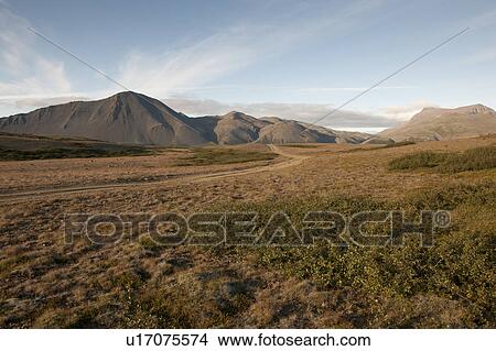 Arid landscape of grasslands and mountains View Large Photo Image Picture - Arid landscape of grasslands and mountains. Fotosearch
