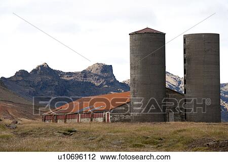 Barn and silos beneath the mountain View Large Photo Image Stock Image - Barn and silos beneath the mountain. Fotosearch