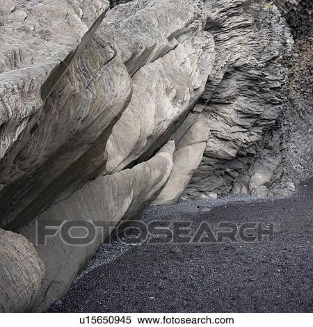 Basalt rock formation cave over sand View Large Photo Image Stock Photography - Basalt rock formation cave over sand. Fotosearch