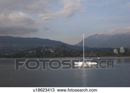 Stock Image - Boat on Coal Harbour in Vancouver British Columbia, Canada. Fotosearch