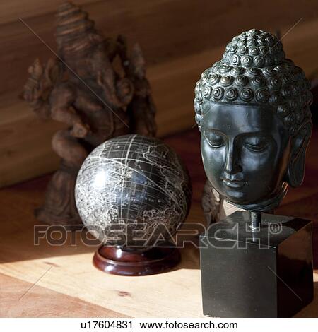 Buddha and stone globe on a table View Large Photo Image Stock Image - Buddha and stone globe on a table. Fotosearch