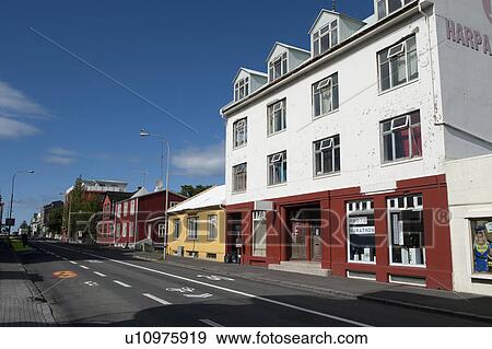 Buildings on pavedcity street View Large Photo Image Stock Photo - Buildings on pavedcity street. Fotosearch